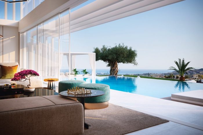 Room with a view. Here, one could claim that the room itself is the view, with a high wall of glass separating the sea, the terrace with its age-old olive tree and the pool from the lounge.