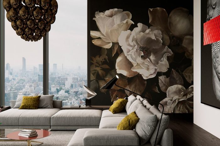 Comfortable designer sofas with a backdrop of floral wallpaper
