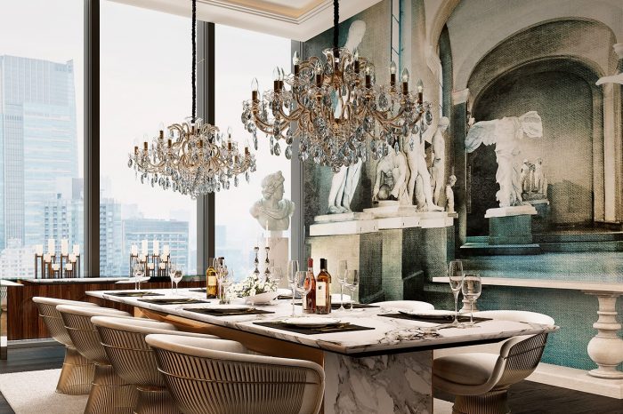 Imposing Masiero chandeliers hover majestically over the solid stone dining table, custom-made by UDesign