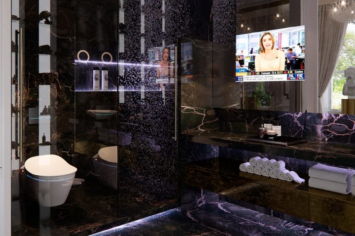 “His” bathroom with the striking dark natural stone, double shower and touches of neon lighting