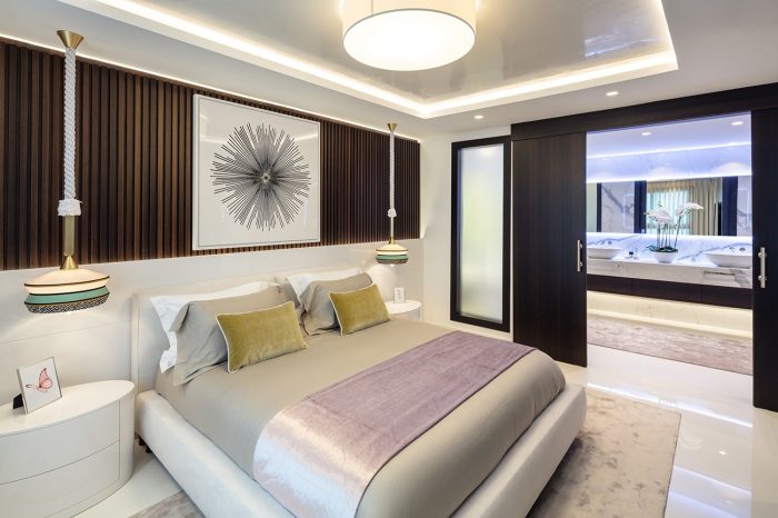 Master bedroom suite with fabulous Contardi lamps, resembling the Tagine. Double sliding doors open into the bathroom letting light from the bedroom flood into the space.