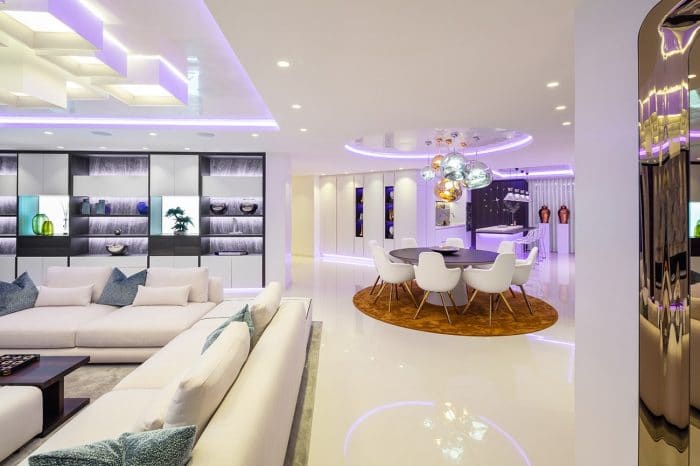 View across lounge towards the custom-wall feature with dining area to the right