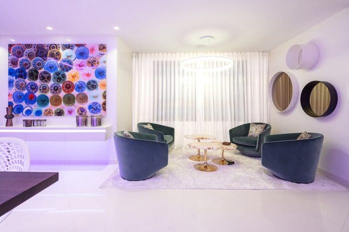 Centre low tables in gold and onyx by Edra. From this window there is a great view of the ferry and boats entering and leaving the port. Someone in the kitchen can see the view in the round “porthole” style mirrors.