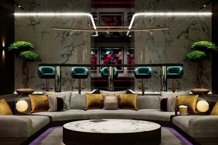 This sunken cinema seating area and the bar stools behind can accommodate up to 14 people.