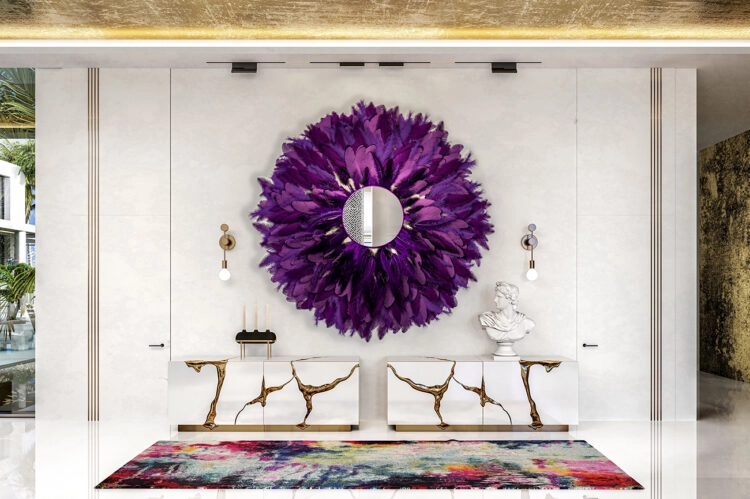 Purple feather mirror hangs above two Boca do Lobo cabinets